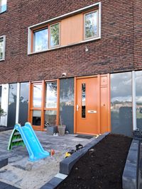 Voordeur grijs + oranje